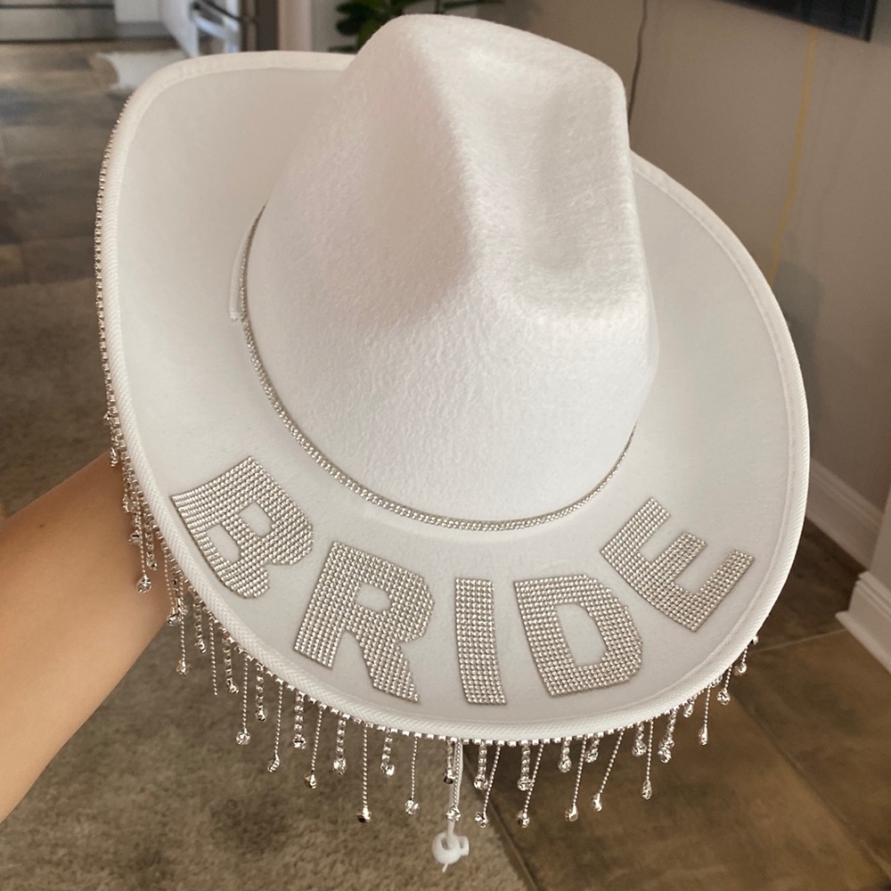 White bride cowgirl hat with rhinestone band and fringe